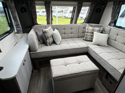 2025 Coachman Lusso III lounge with footstool